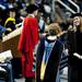 Michigan graduates receive their degree and shake hands with President Mary Sue Coleman on Sunday. Daniel Brenner I AnnArbor.com
